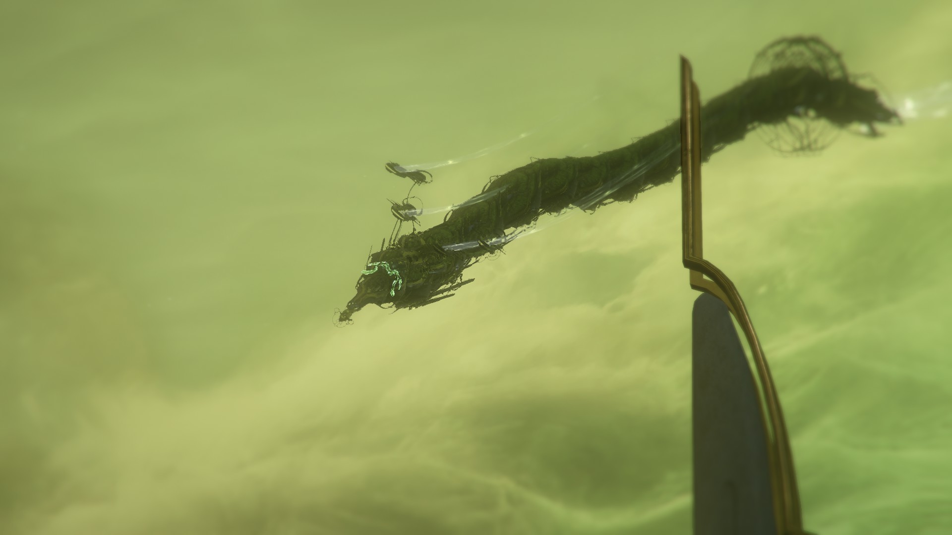 an ornate, serpentine creature floating in a green, cloudy sky, a white and gold structure in the foreground obscures part of its body. Its body is biomechanical and segmented, two rings are seen near the end of its body and a pair of entwined snakes are visible on its head, just behind the snakes are four cable-like protrusions which each end in structures which somewhat resemble light bulb filaments.